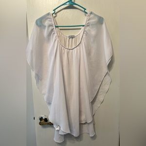 White blouse with a tank, and then a sheer cover.